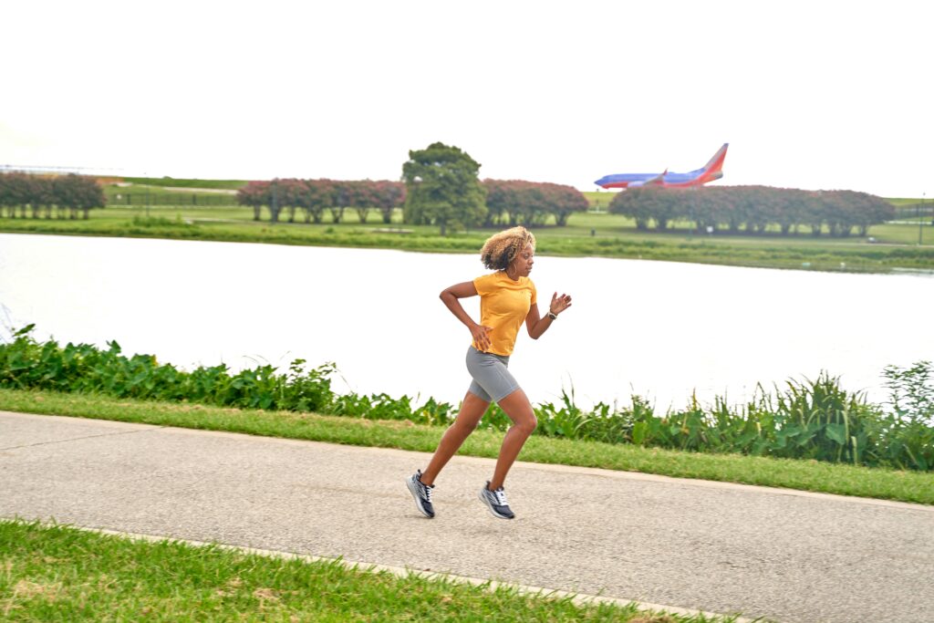 Mature runner in their 50s training outdoors staying healthy and active with proper form