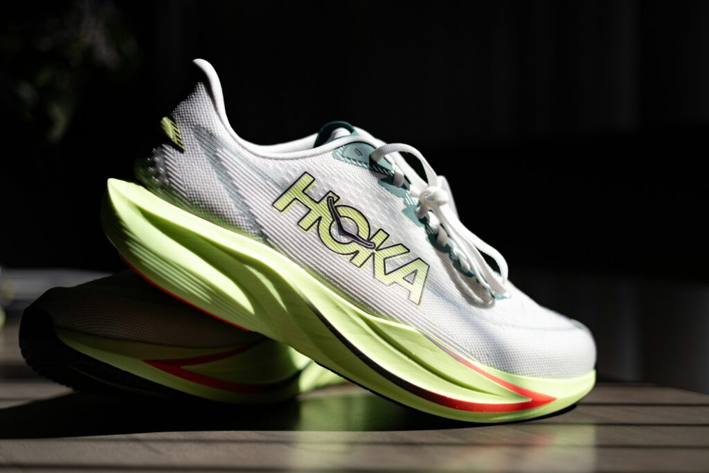 Comparison of Hoka Clifton running shoes versus cheaper alternative brands showing maximum cushion options for budget-conscious runners